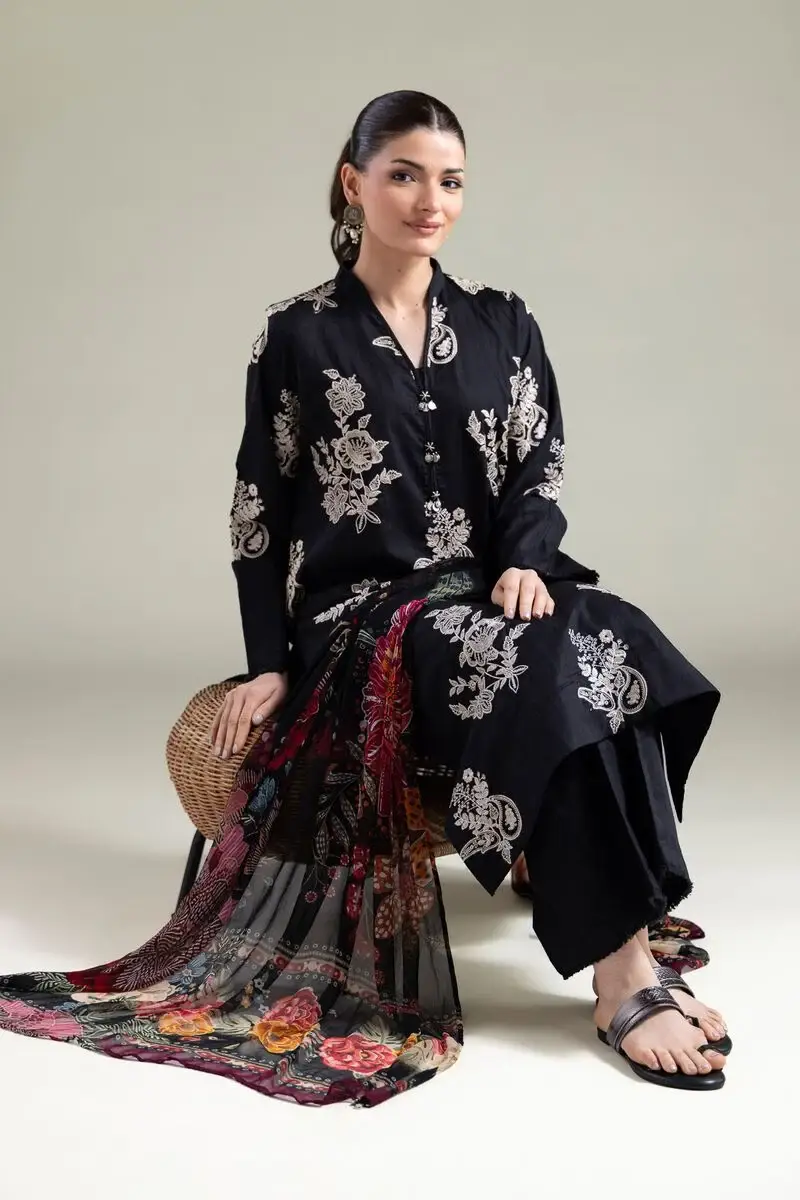 Details Floral Longline Kurta Fit: Regular Fabric Composition: 100% Cotton Material: Cotton Dobby Description: Black floral and paisley embroidered kurta with full sleeves, a band collar and V-neckline. Cotton dobby fabric features thread-work and silver coins. Solid Relaxed Pants Fit: Relaxed Fabric Composition: 100% Cotton Material: Cotton Dobby Description: Black solid pants in cotton dobby, featuring fringe detailing at the hems.